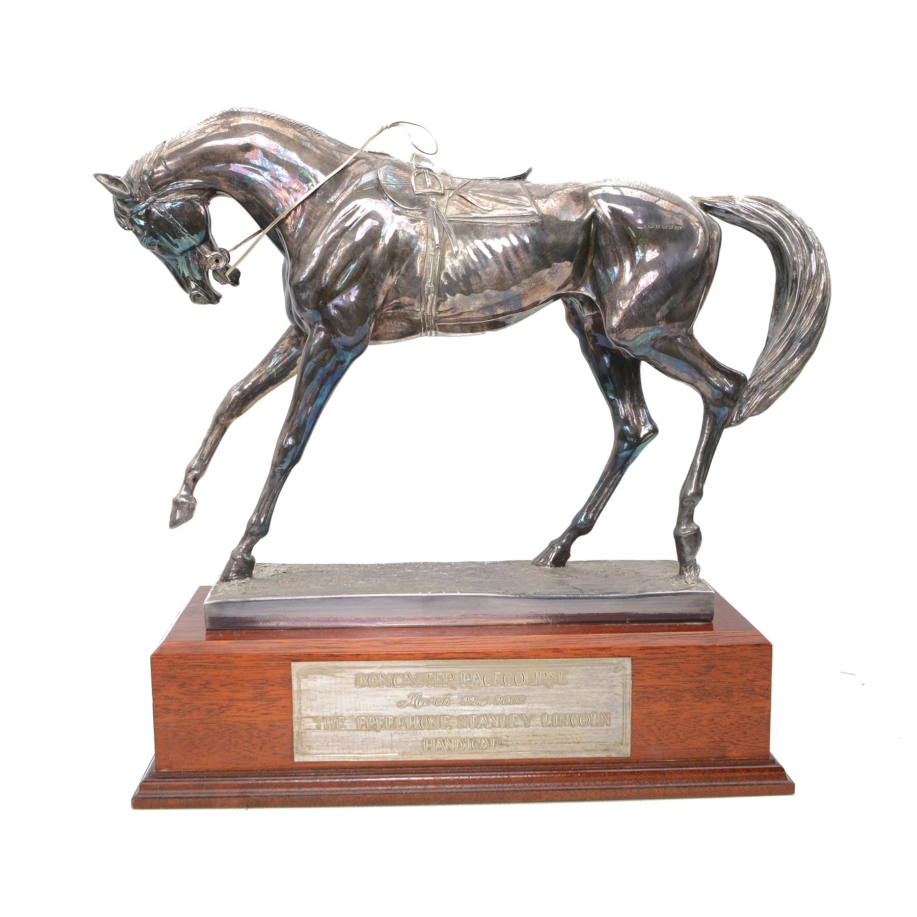 'The Freestone Stanley Lincoln Handicap Trophy, Doncaster Racecourse March 22nd 2003' - Silver filled model of a racehorse H32cm x W42cm on a mahogany plinth with silver plaque Sheffield 2003 Maker Laurence R Watson & Co.; together with a framed photograph of Guy Reed receiving the trophy (2)
