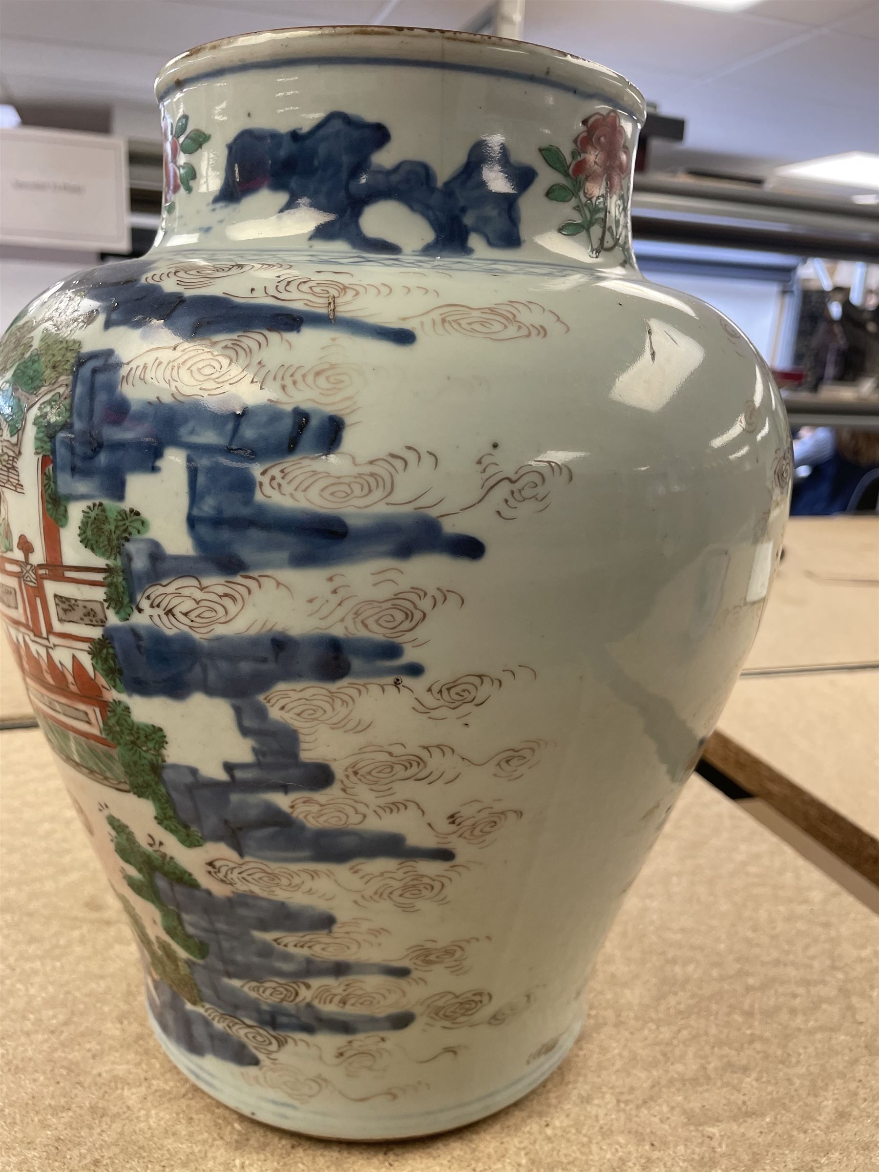 17th century Transitional period Chinese Wucai vase and cover, of baluster form, the body painted with ladies upon a terrace, and figures upon horseback and attendants within a fenced garden, the domed cover with knop finial painted with boys at play, H37cm
