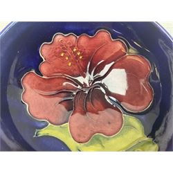 Moorcroft rectangular pin dish decorated in the Clematis pattern upon cobalt blue ground, together with a small circular footed dish decorated in the Hibiscus pattern, both with impressed marks beneath, tray L20cm (2)