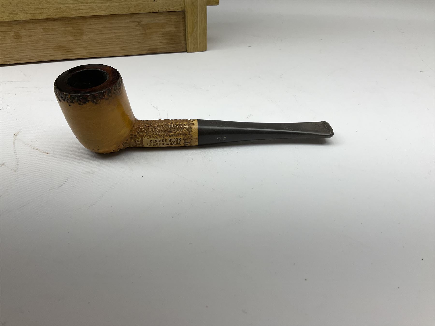 Pipes and two tiered wooden rack together with eleven pipers, including briar pipe carved as a wolf, Sea Dog straight pipe, John Brumfit pipe, meerschaum pipe ect, pipe rack H29.5cm