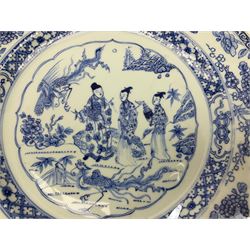 Pair late 18th/early 19th century Chinese export plates, decorated with a central panel of three figures and phoenix in a landscape set with fence and flowers, within floral and diaper borders, D32cm 
