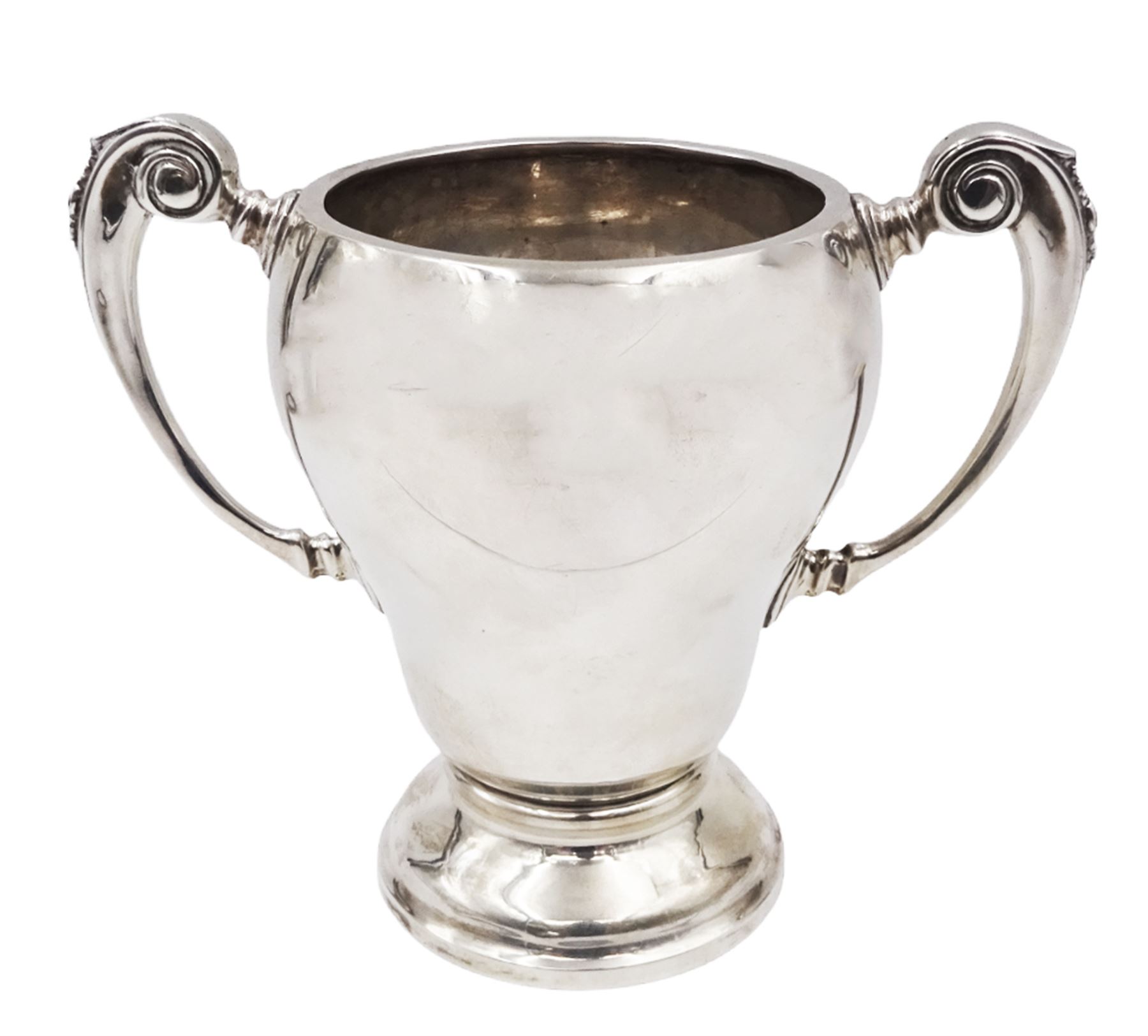 1920s silver trophy cup, of typical form, with twin C scroll handles, upon stepped circular base, hallmarked Birmingham 1926, maker's mark worn and indistinct, H14cm