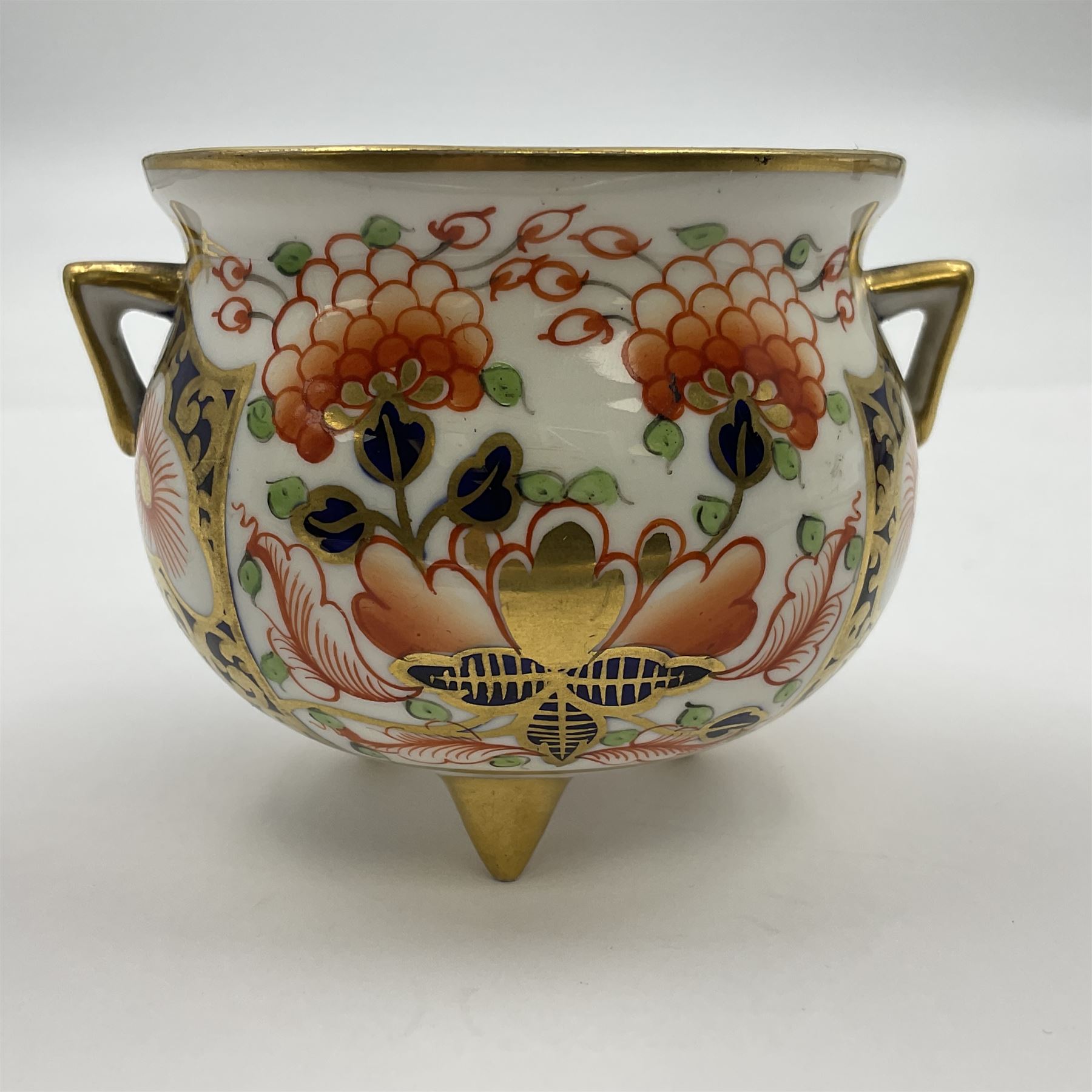 Group of Crown Derby and Royal Crown Derby Imari pattern miniatures, including mid 19th century Stevenson and Hancock cauldron, with painted mark beneath, H5.5cm, a near pair of early Royal Crown Derby scuttles, decorated in the 6299 pattern, each with printed and painted marks beneath including illustration date codes for 1913 and 1922, tallest 6.5cm, and a further early 20th century Royal Crown Derby scuttle, decorated in the 6299 pattern, with printed and painted marks beneath including illustration date code for 1922, H5.5cm, (4)
