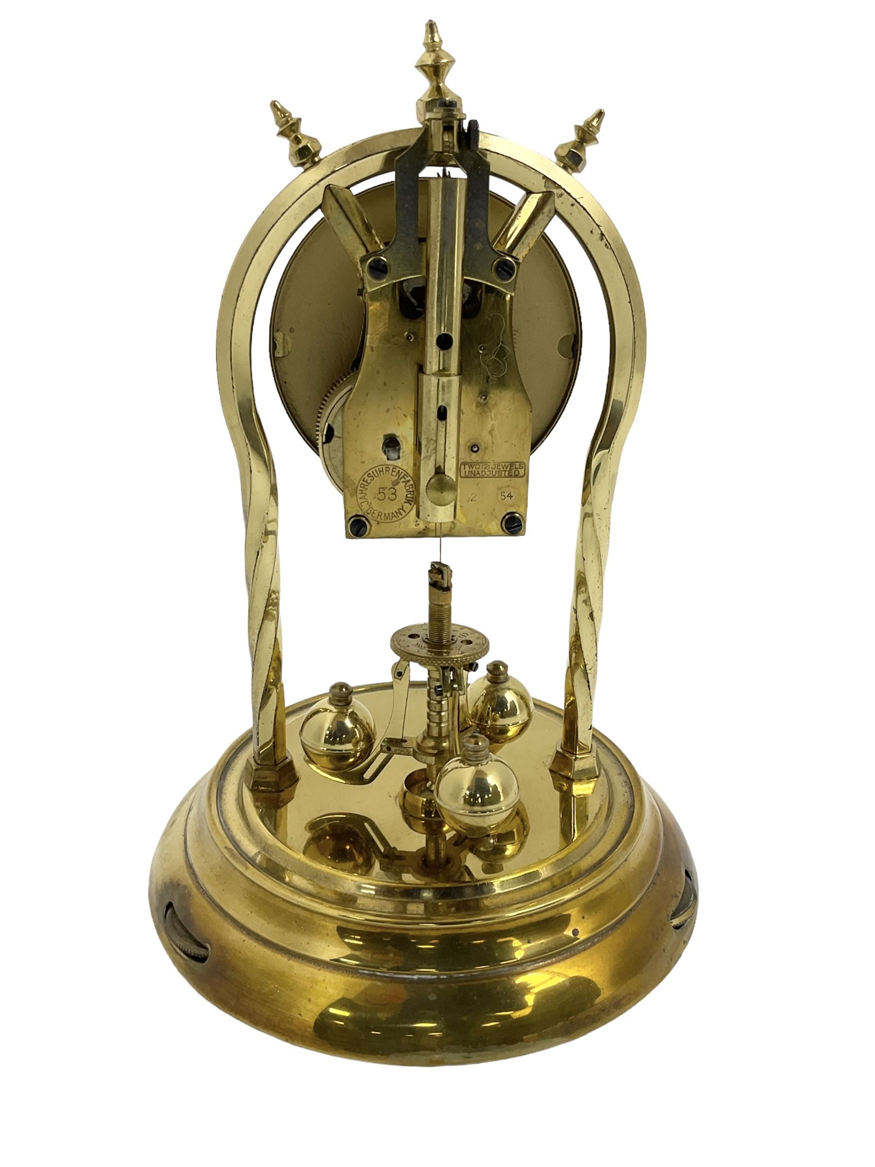 Schatz - mid-20th century German 400 day torsion clock, with a gilt dial and black chapter, Arabic numerals and pierced hands, three ball rotary pendulum and glass dome, original box, packaging and instruction booklet. Torsion suspension spring intact.
