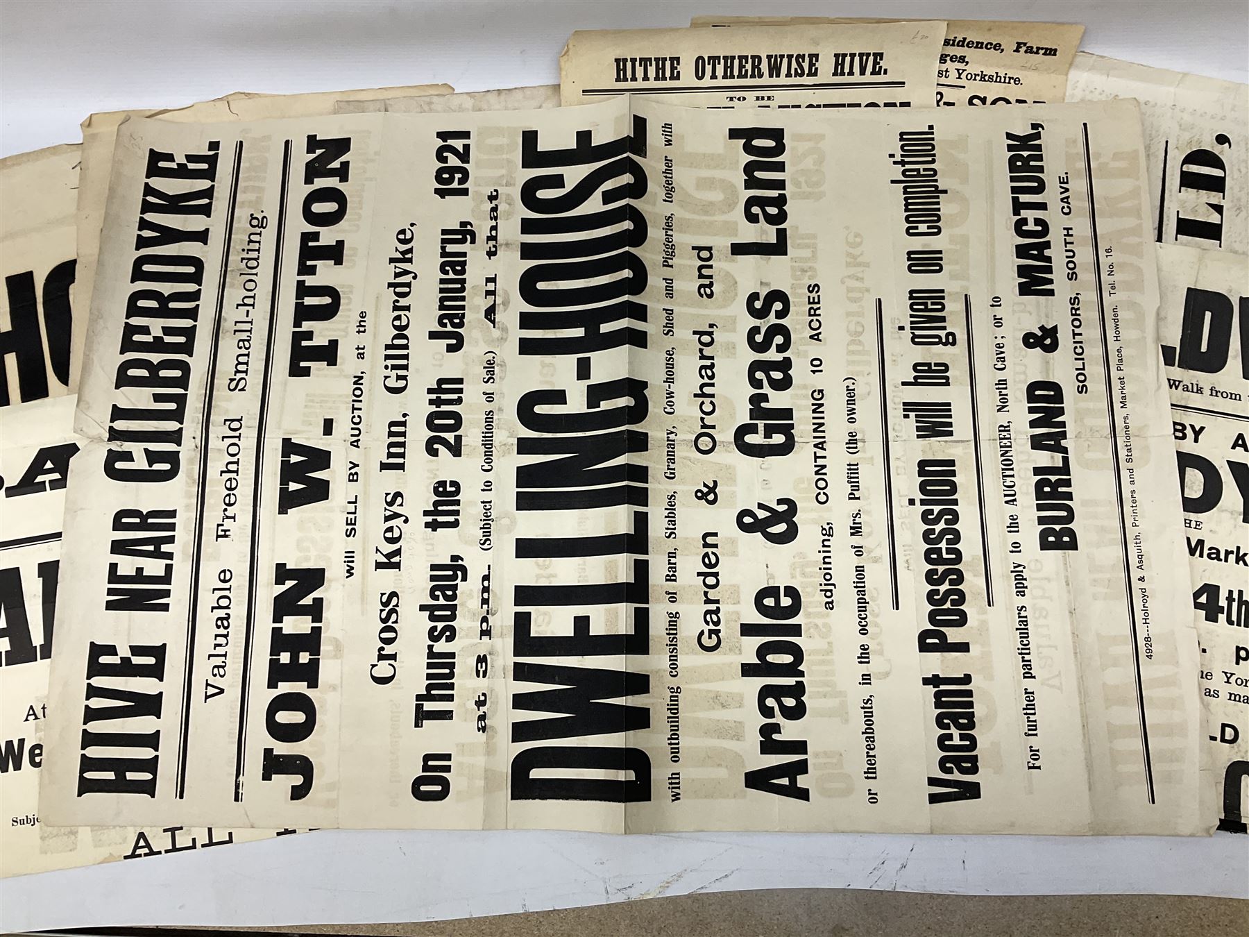 Seven late 19th/early 20th century auction posters of Hull/Yorkshire interest for properties in Hithe (Hive) 1852, South Cave 1880, Ellerker 1904, Hive 1921, Osbaldwick 1921, Balfour Street Hull 1922 and Sancton 1922; another for Cumberland 1824; two early 'This House To Let' posters; posters unframed and folded; and auction particulars for Gator Court, Ashburton, South Devon 