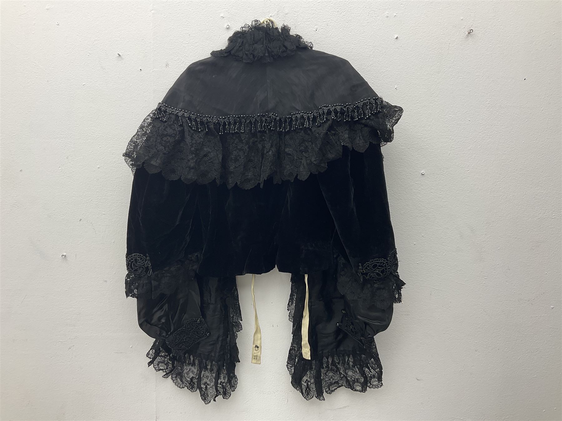 Victorian three piece mourning dress, with lace trim and jet beading, including velvet coat with satin collar panels and cuffs, the nipped waist with boning and slight flared peplum, heavily embellished beaded high neck collar, and ladies embroidered silk lined purse with gilt handle, mount and clasp