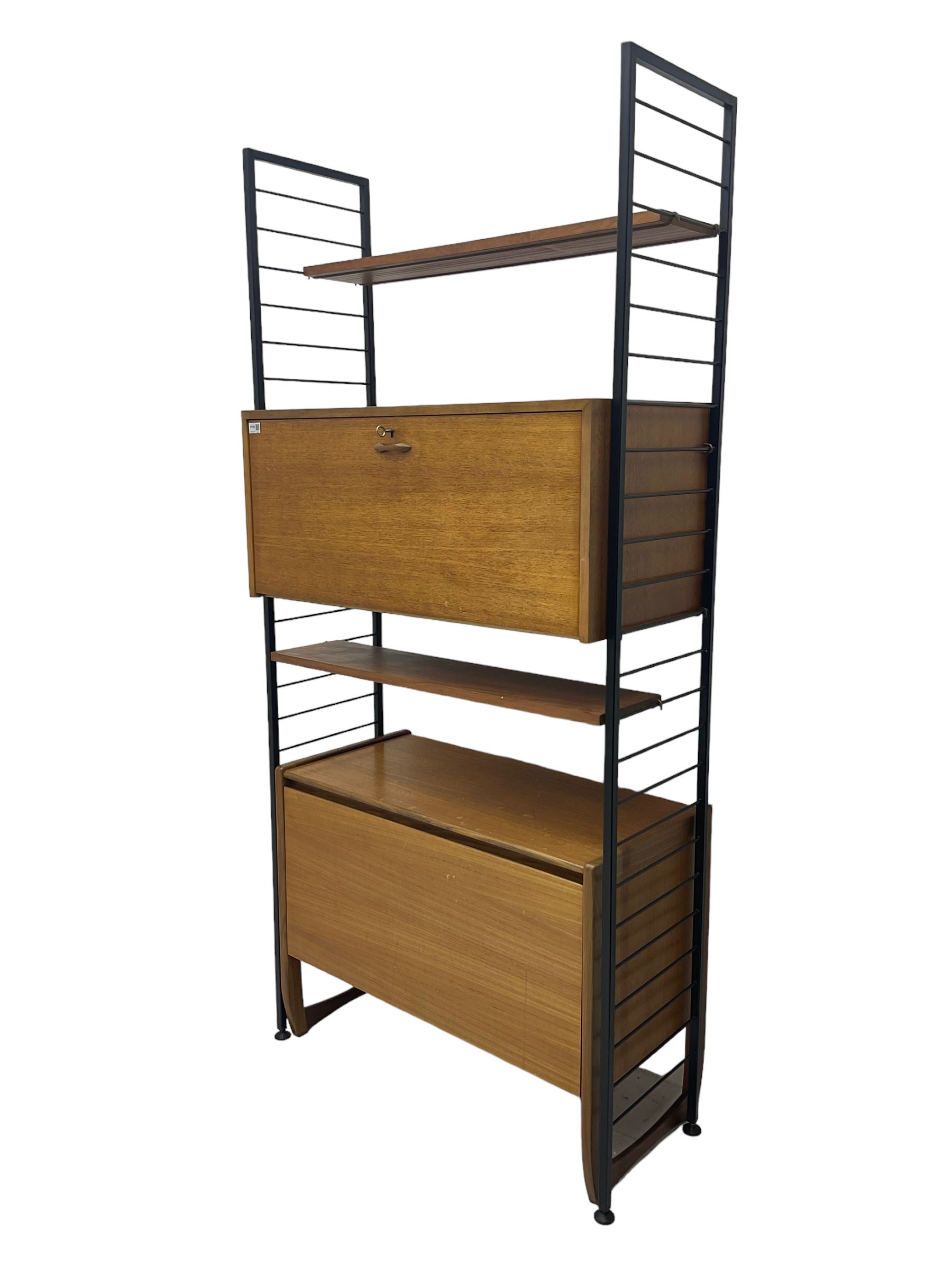 Staples Ladderax - mid-20th century teak and metal framed modular wall unit, fitted with central fall-front cupboard enclosing correspondence dividers, over secondary separate teak fall-front cupboard, adjustable shelf to top