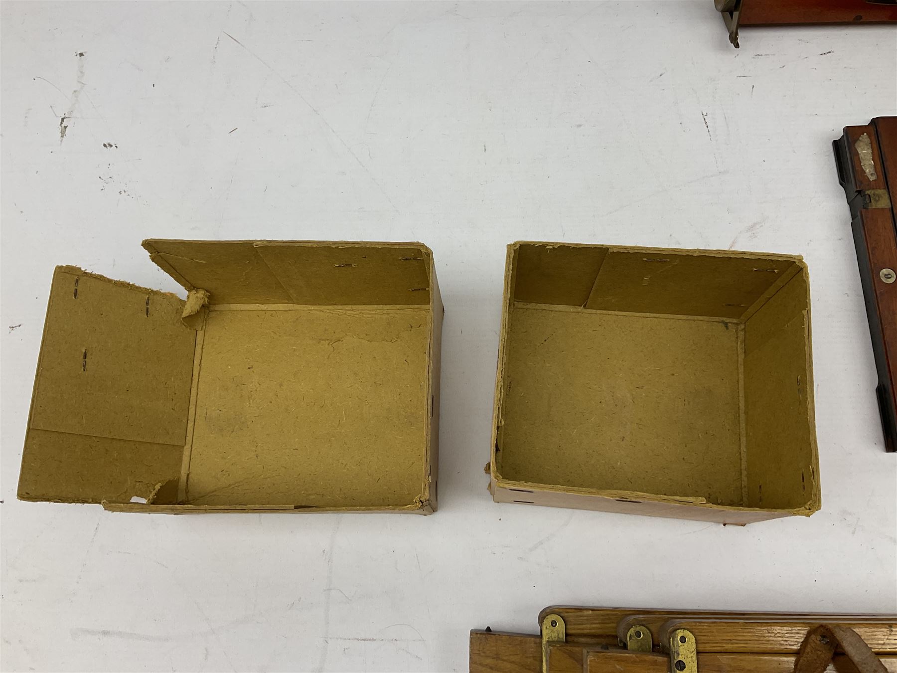 Thornton Pickard Imperial Triple folding plate camera in mahogany and lacquered brass, field model, three mahogany photographic plates and a wooden tripod