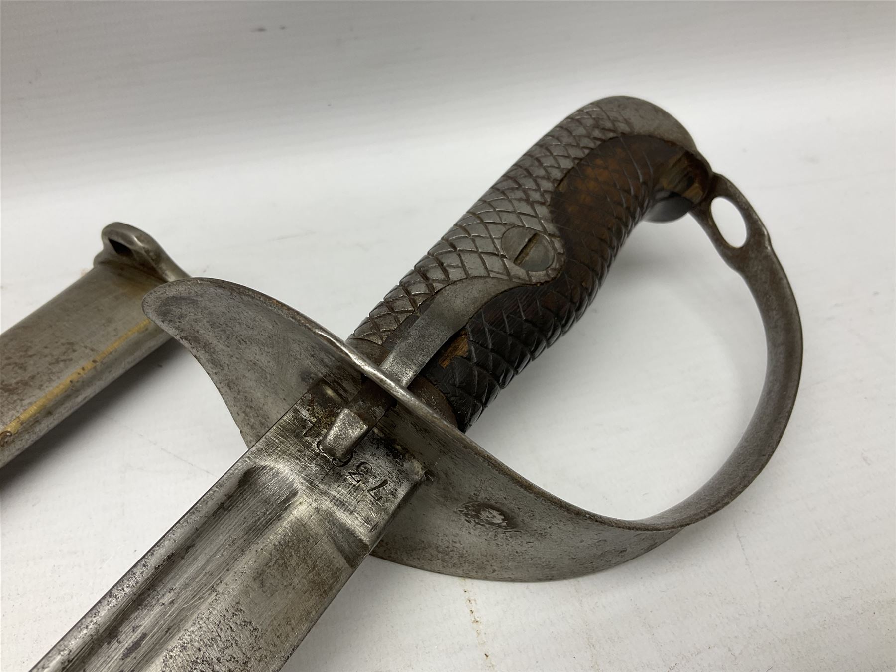 Japanese Model 1899 Type 32 'Otsu' pattern army sword, with 76.5cm single edged, slightly curved blade with narrow fuller, numbered 73684 to the ricasso;  steel hilt with chequered backstrap and grip ears with wooden chequered grip and locking action;  in steel scabbard with single hanging ring L93cm overall