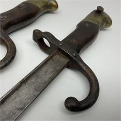 Two 19th century French model 1874 epee bayonets, each with 52cm steel blade, and armoury dates for 1880 and 1881 L64cm overall (2)