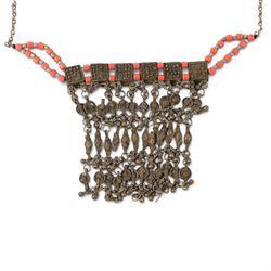 Collection of Middle Eastern jewellery, including silvered multi strand necklace with beadwork and filigree decoration with three cylindrical pendants, pendant necklace with central orange cabochon, beadwork choker and similar  