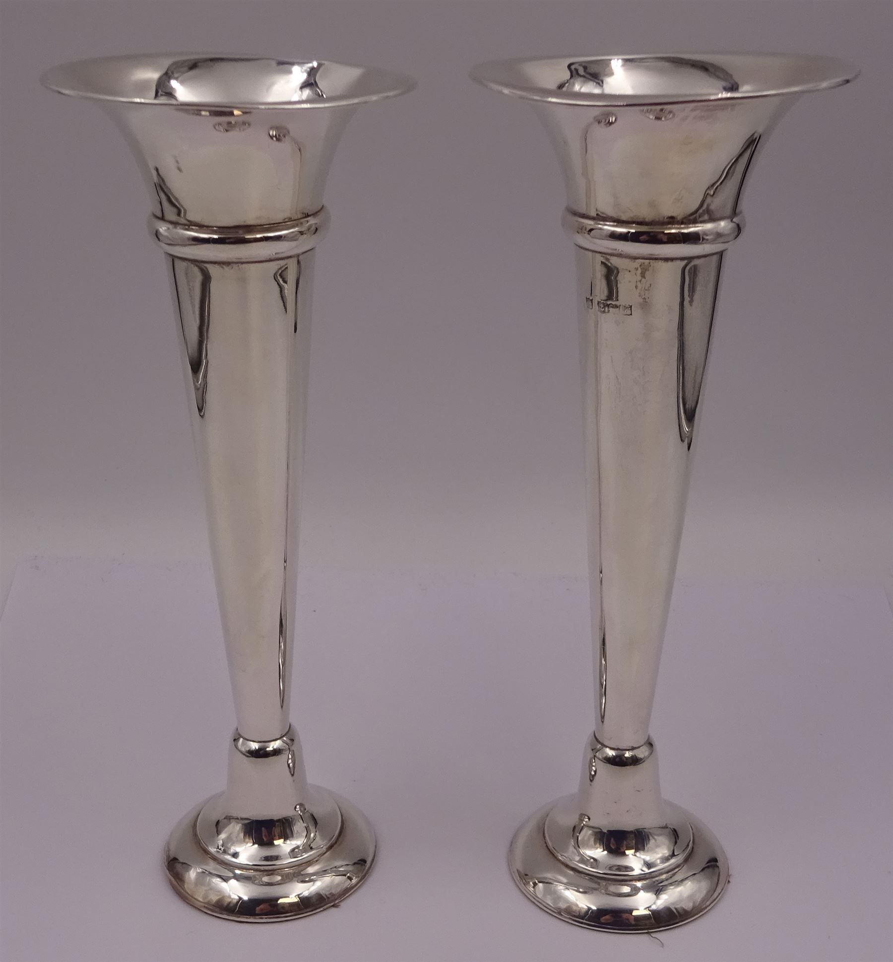 Pair of modern silver trumpet vases, each with fluted rim, upon tapering stem and slightly domed weighted circular foot, hallmarked Charles S Green & Co Ltd, Birmingham 1971, H20cm