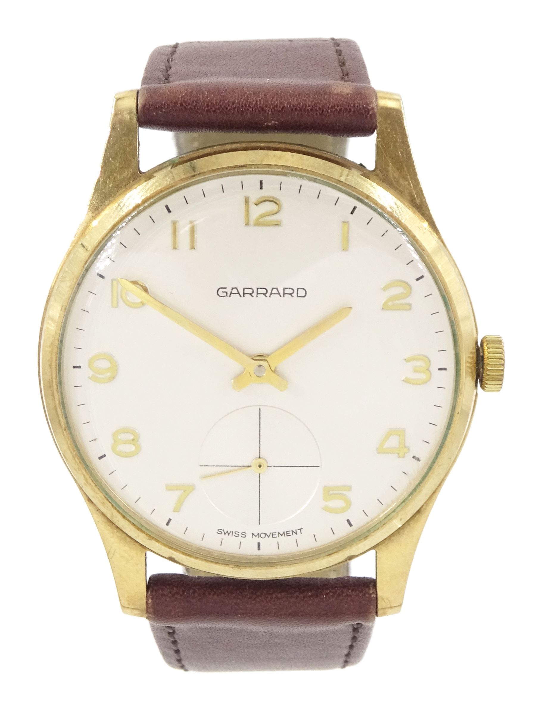 Garrard gentleman's 9ct gold manual wind wristwatch, silvered dial with Arabic numerals and subsidiary seconds dial, London 1978, on brown leather strap, boxed