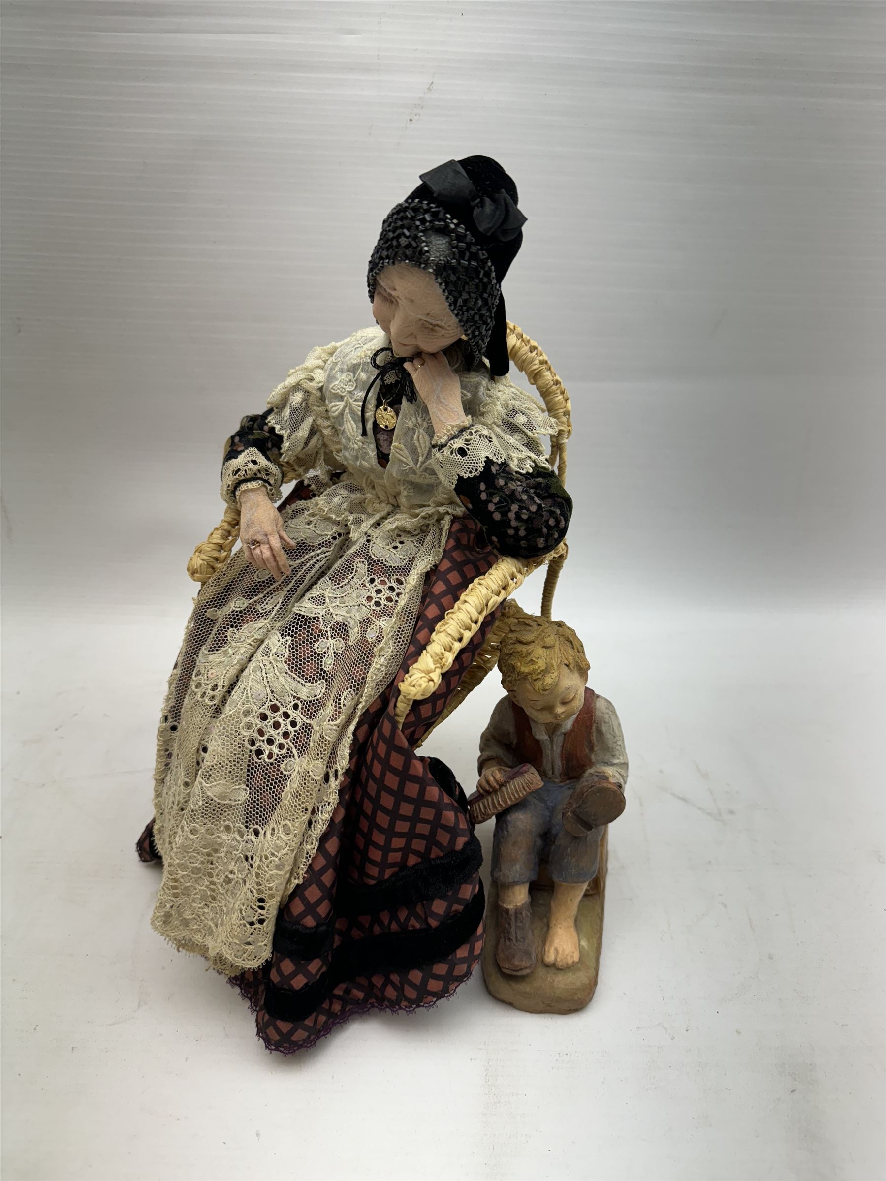 Anna Meszaros (Hungarian 1905-1998): 'My Great Granny', handmade needlework figurine, together with small plaster cast of a young boy by the same artist, granny H30cm
Auctioneer's Note: Anna Meszaros came to England from her native Hungary in 1959 to marry an English businessman she met while demonstrating her art at the 1958 Brussels Exhibition. Shortly before she left for England she was awarded the title of Folk Artist Master by the Hungarian Government. Anna was a gifted painter of mainly portraits and sculptress before starting to make her figurines which are completely hand made and unique, each with a character and expression of its own. The hands, feet and face are sculptured by layering the material and pulling the features into place with needle and thread. She died in Hull in 1998