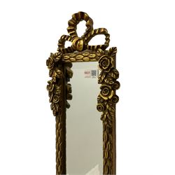 Narrow gilt ribbon mirror, and an oval ornate wall mirror