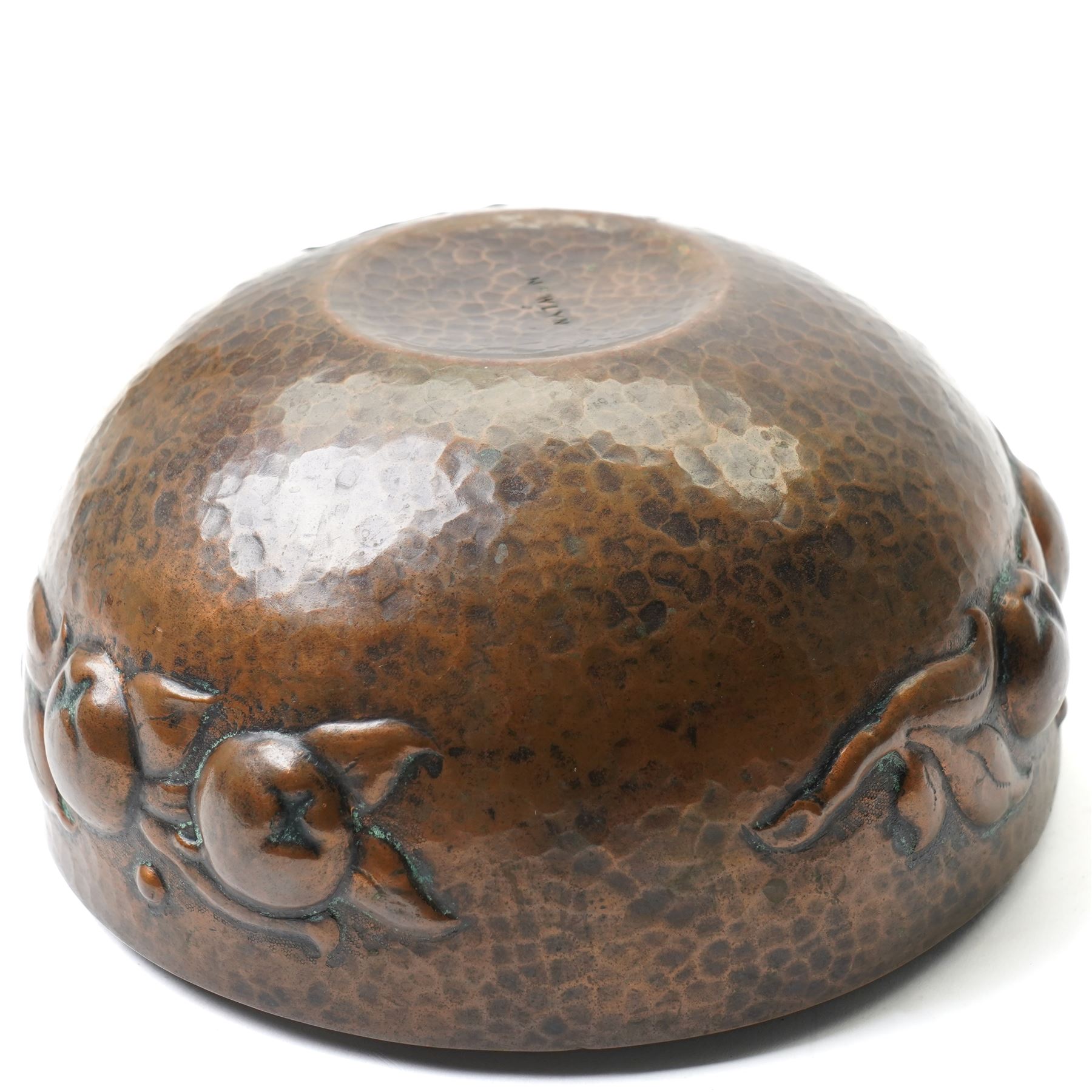 Newlyn school Arts and Crafts copper rose bowl, the planished exterior with fruit and leaves in high relief, H8.5cm x W18cm