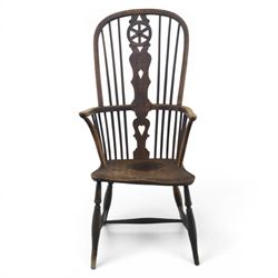 19th century Provincial wheelback Windsor armchair, high stick back, saddle seat on four turned legs with H-stretchers