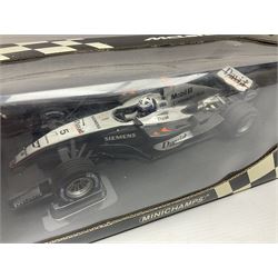 Three Minichamps 1:18 scale die-cast McLaren racing cars - Mercedes MP4-19 D. Coulthard; Mercedes MP4-20 K. Raikkonen; and Vodaphone Mercedes MP4-22 L. Hamilton 2007; all boxed (3)

