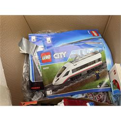Very large collection of Lego, predominantly loose but some part constructed models, including Lego City, Lego Technic, Chima, Arctic 5, train set, mobile crane etc; together with numerous instruction booklets and some empty boxes; contained in two large cardboard boxes with gross weight of over 24kgs