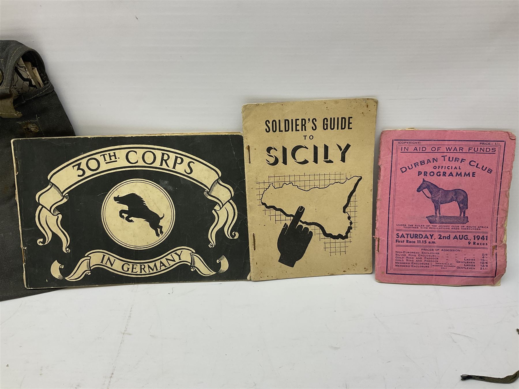 WW2 German War Pass (Wehrpass) identification paperwork for Walter Fensterseifer 2nd type booklet dated 8/6/1940, with signed photo of recipient in civilian suit. Born 31st January 1921. Numerous entries; together with quantity of small private photographs of German soldiers; One Million mark banknote 1923; 30th Corps in Germany booklet with Formation badge; and other WW2 paper ephemera
