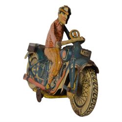 Tipp & Co tinplate clockwork motorcycle no. T686, the motorbike in dark blue with Dunlop cord wheels in cream, the civilian rider in orange clothing, H12.5cm ,W19cm
