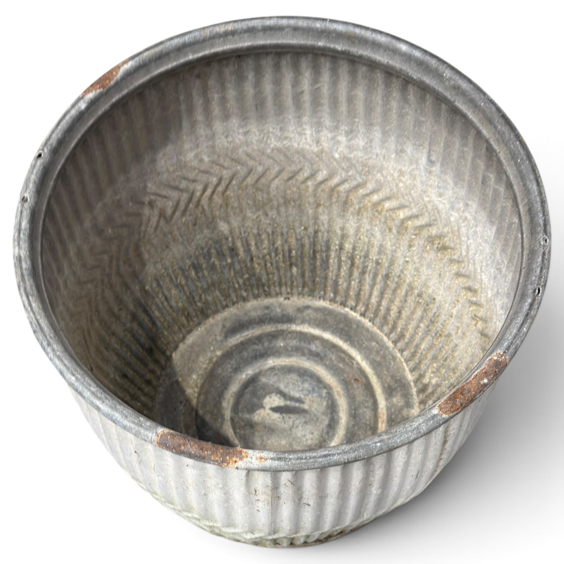 Two20th century galvanised metal dolly tubs, with rolled rims above corrugated bodies centred by chevron bands and circular bases, max W48cm H52cm)