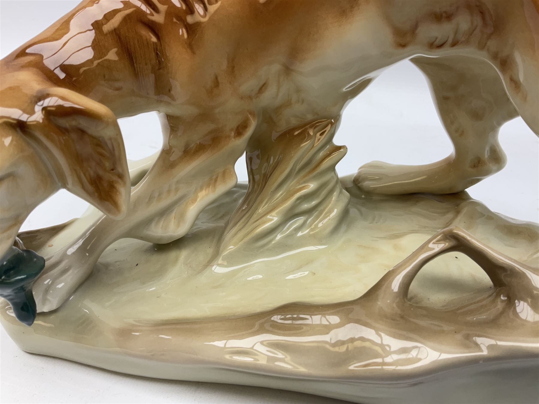 Royal Dux porcelain hunting dog with a bird, printed mark beneath, L36cm