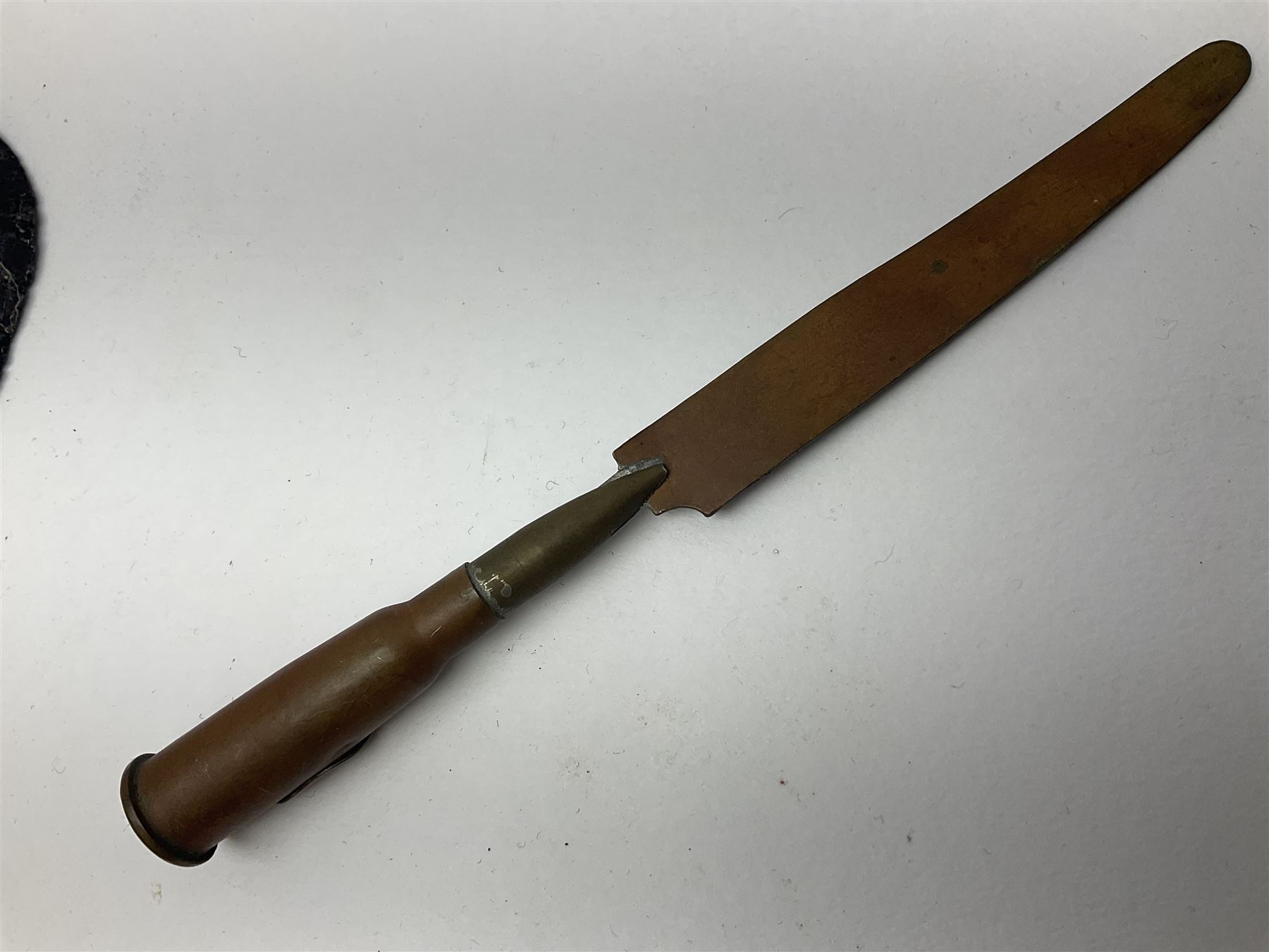 WW1 Short & Mason Ltd 'The Magnapole' black japanned brass field compass in leather carrying case; WW1 trench art paper knife inscribed Dixmude; and small quantity of cloth badges etc