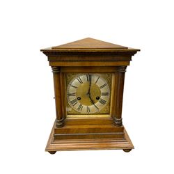 German  - H.A.C. mahogany cased 14-day striking mantle clock, in an architectural case with a gable pediment, square brass dial and silvered chapter ring flanked by two turned pillars with capitals, wide stepped plinth raised on bun feet. With pendulum and key.
.