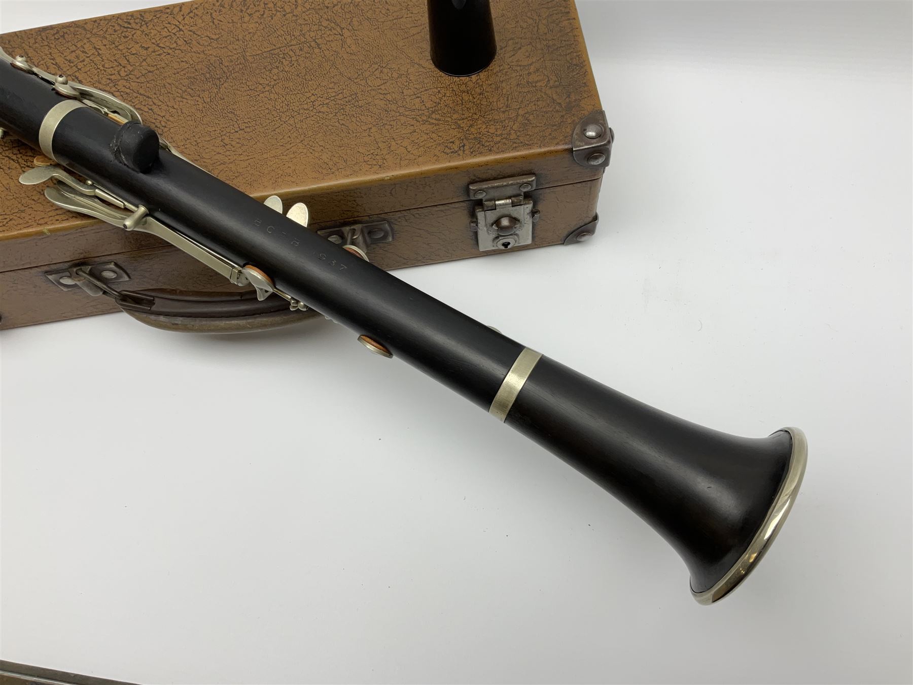 Buffet Crampon Paris African blackwood four-piece clarinet with nickel fittings, impressed 'BCPB 1937', multiple stamps for 'Macdonough & Son Sole Agent London' L67cm; in rexine covered case with two unused reeds. Biographical information: The Macdonagh family have links with the Royal Philharmonic Orchestra and are also reputedly linked with Thomas Macdonagh who was involved in the 1916 Irish uprising.