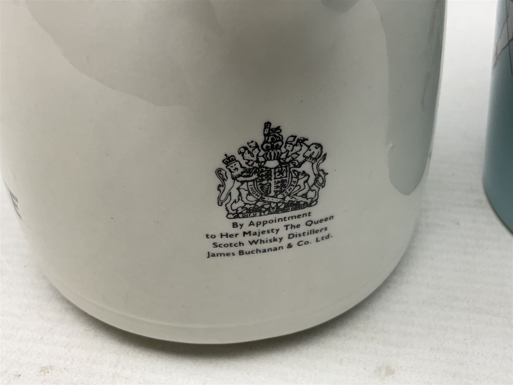 Six whisky water jugs, to include Wade Johnnie Walker, Haig, Black & White, etc