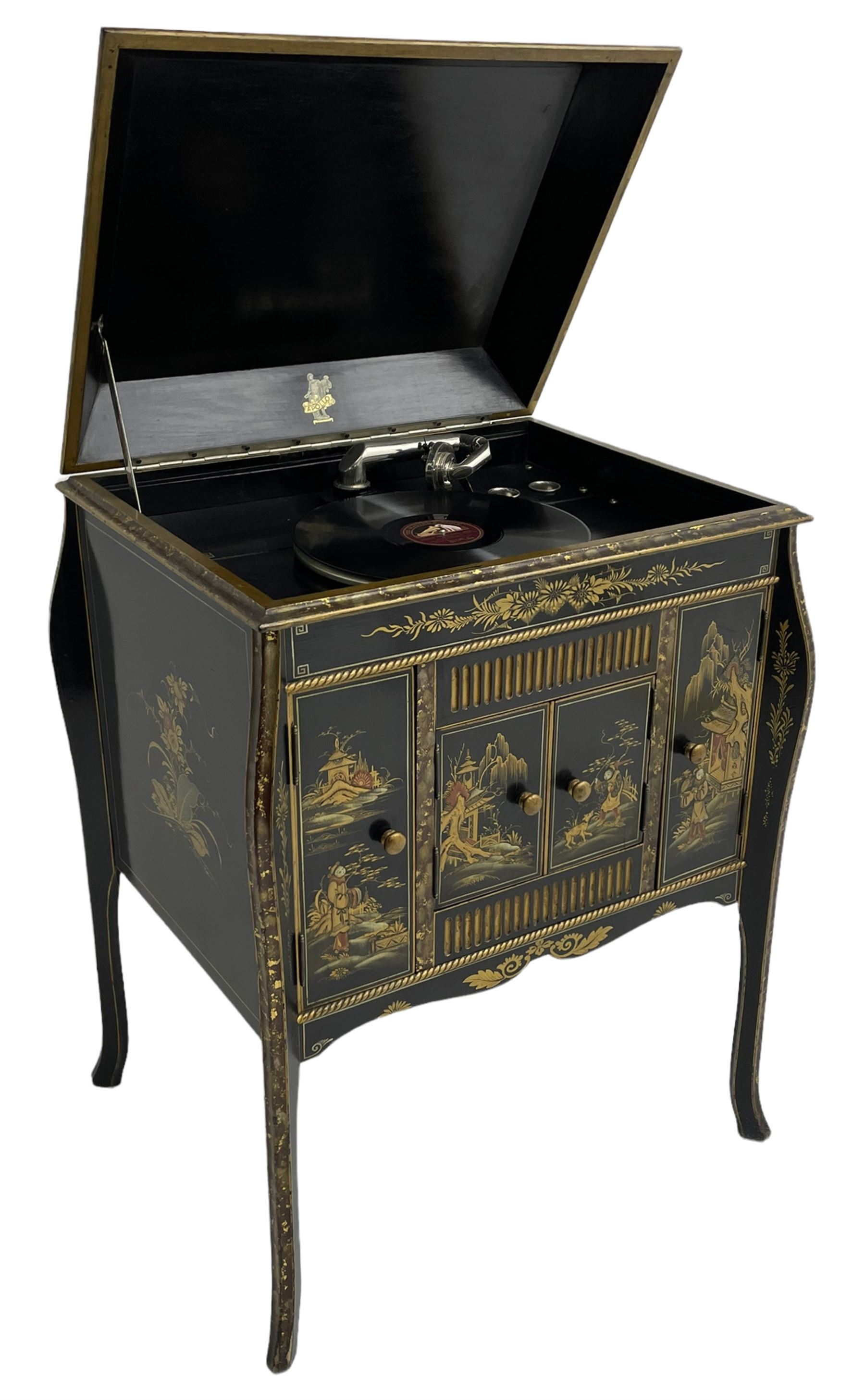 Early 20th century Chinoiserie lacquered gramophone cabinet, the lid decorated with raised gilt work, traditional landscape and figural scenes, fitted with 'Apollo' 'No. 114' gramophone, cupboards below, on cabriole supports