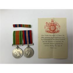 Twelve WW2 medals comprising four 1939-1945 war medals, four Defence medals, three 1939-1945 Stars and Africa Star; all with ribbons; some as groups in two issue boxes with slips