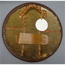  Replica Scottish Highlander's Targe by Joe Lindsay, based on an original targe traditionally known as 'Lord Lovats Targe', the wooden shield covered in tooled leather with traditional Celtic designs, brass studs and mounts with deer skin hide verso, D49cm   