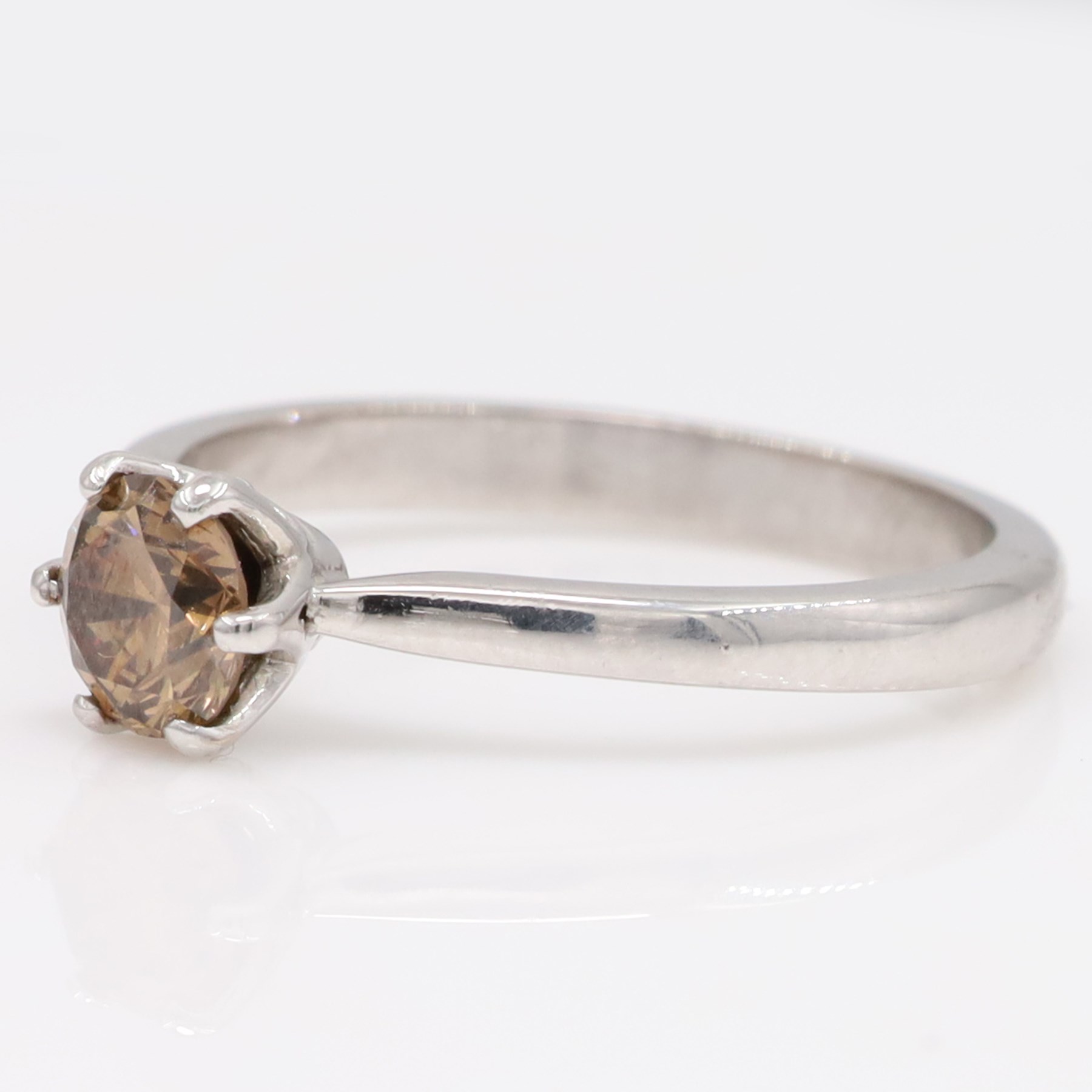 18ct white gold fancy brown diamond ring, six claw set with a round brilliant cut diamond of approx 0.80 carat, hallmarked