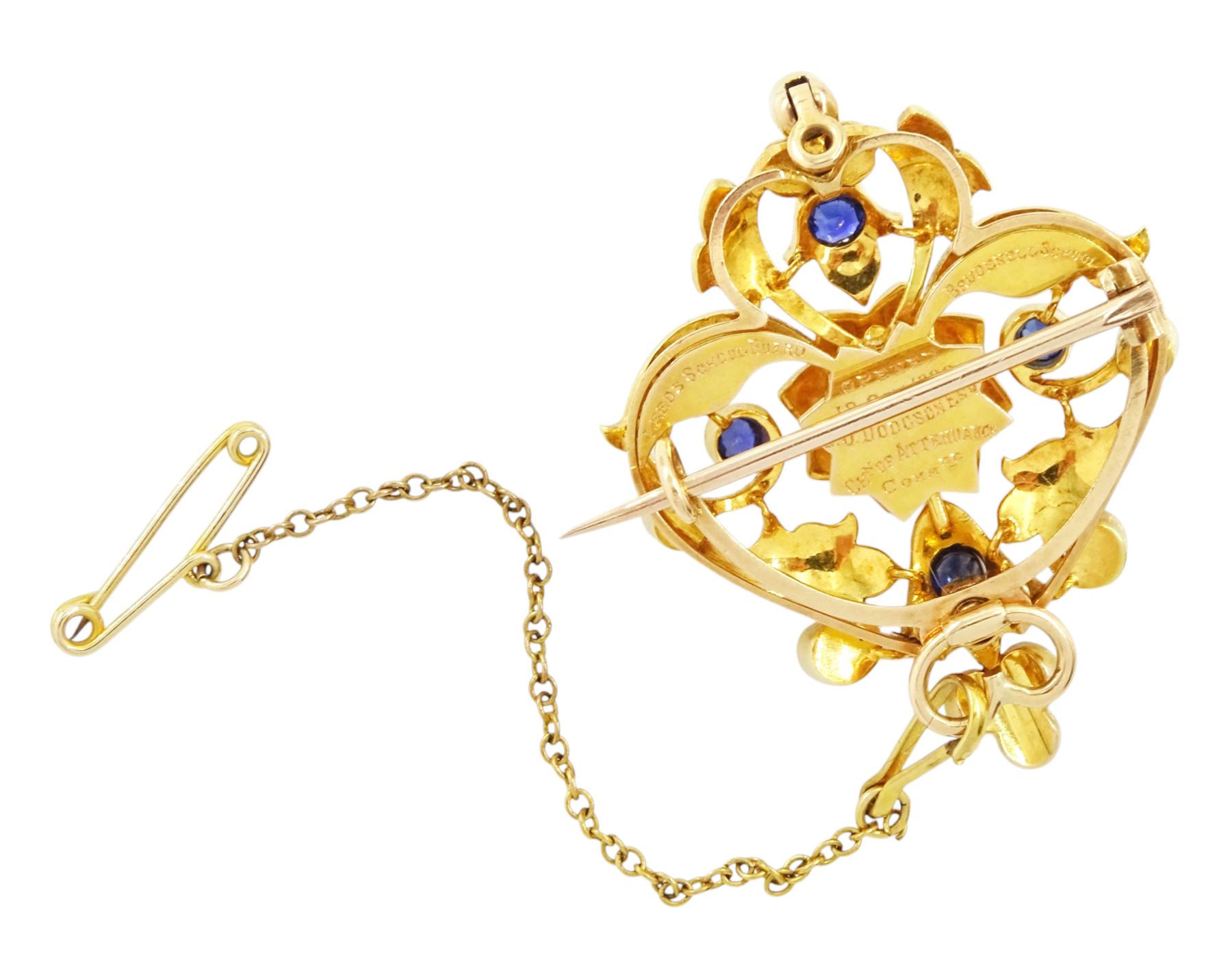 Victorian 15ct gold sapphire and split pearl pendant / brooch, the central flower head cluster set with a round cut sapphire surrounded by pearls, amongst an openwork setting set with four further sapphires and pearls, the reverse with presentation engraving and detachable brooch setting