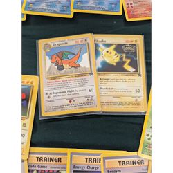 Collection of Pokemon TGC trading cards, including two WB First Movie Black Star promo cards Pikachu no. 4 and Dragonite no. 5, two Ancient Mew Black Star holo promo cards, Gym Challenge Giovanni's Persian 8/132 holo and a small collection WOTC, Neo Discovery and Neo Genesis cards, together with thirty four Bandai Carddass Pokemon cards, including prism Charizard no. 186 and Pokemon Topps cards including holo examples 