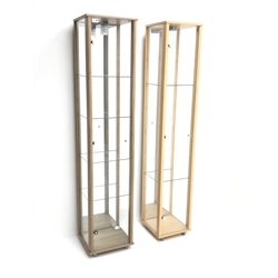  Two illuminated tall floor standing display cabinets with adjustable glass shelves, (36cm x 33cm, H172cm) and (32cm x 32cm, H172cm)  