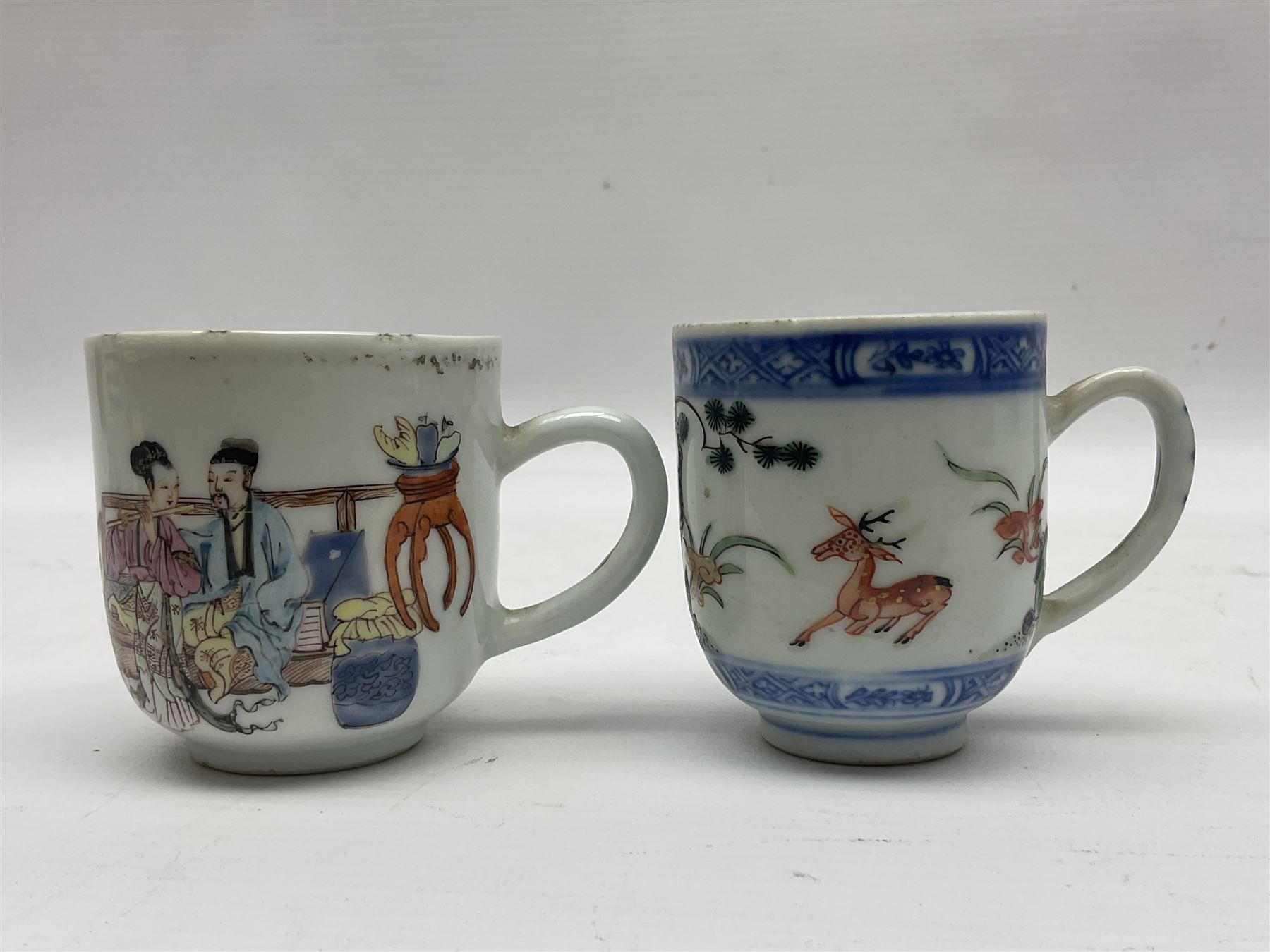 Two 18th century Chinese Yongzheng coffee cups, the first example decorated in polychrome enamel with rooster amidst blossoming peonies, the second decorated with deer and crane among rockwork and pine tree, together with two further 18th century Chinese coffee cups, an 18th century Chinese tea bowl, and a further tea bowl