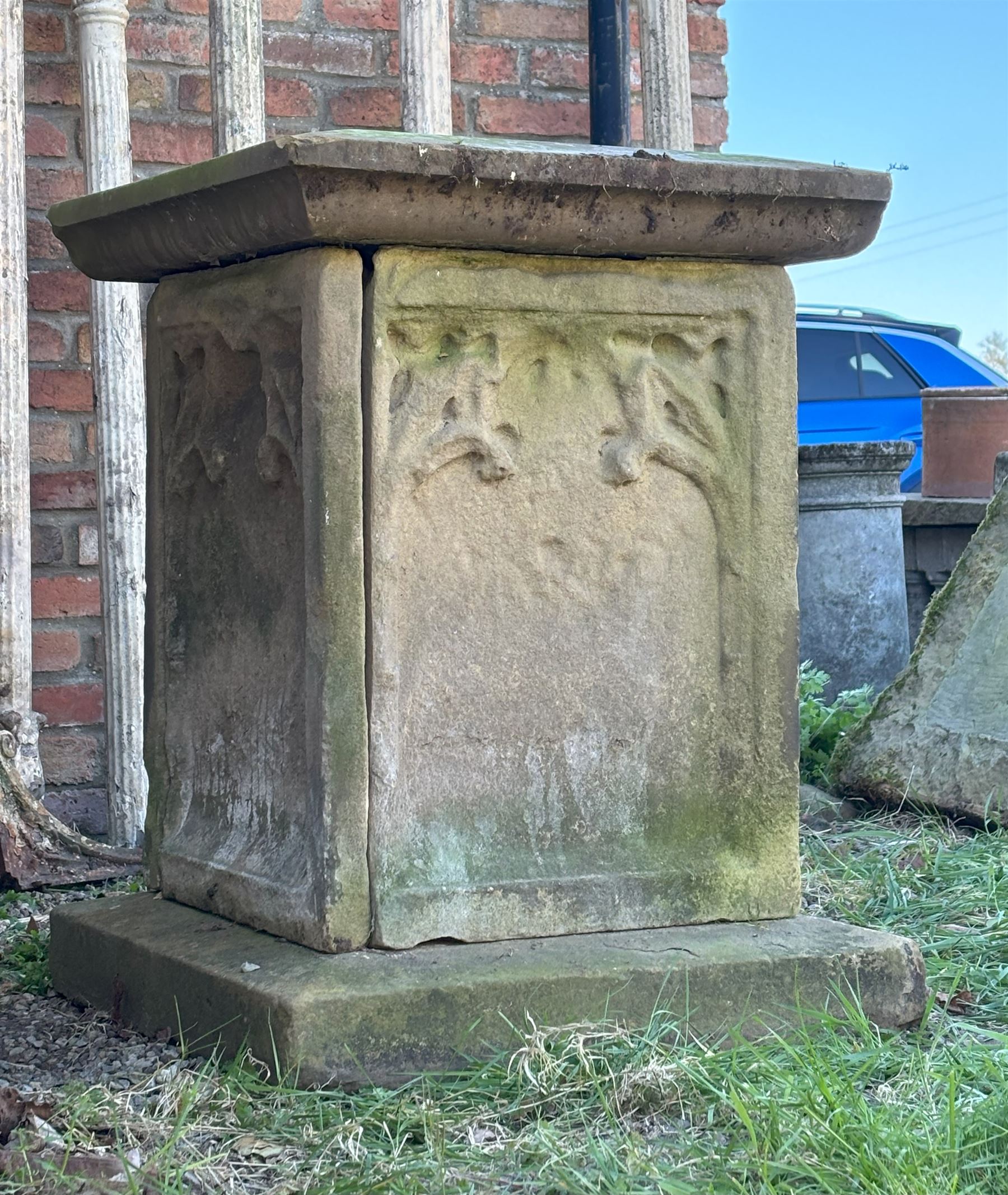 Carved sandstone garden plinth / tomb, probably 17th century, the square top above four tracery carved panels with floral motifs, on a conforming base. H83cm, 64cm x 64cm.  - COLLECTION BY APPOINTMENT FROM: The White House, Thirsk Road, Easingwold, York, YO61 3NF - CALL 01723 507111 TO ARRANGE
