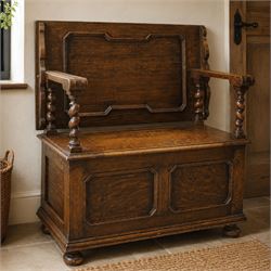 Early 20th century oak monks bench, panelled back converting to a table top, reeded armres...