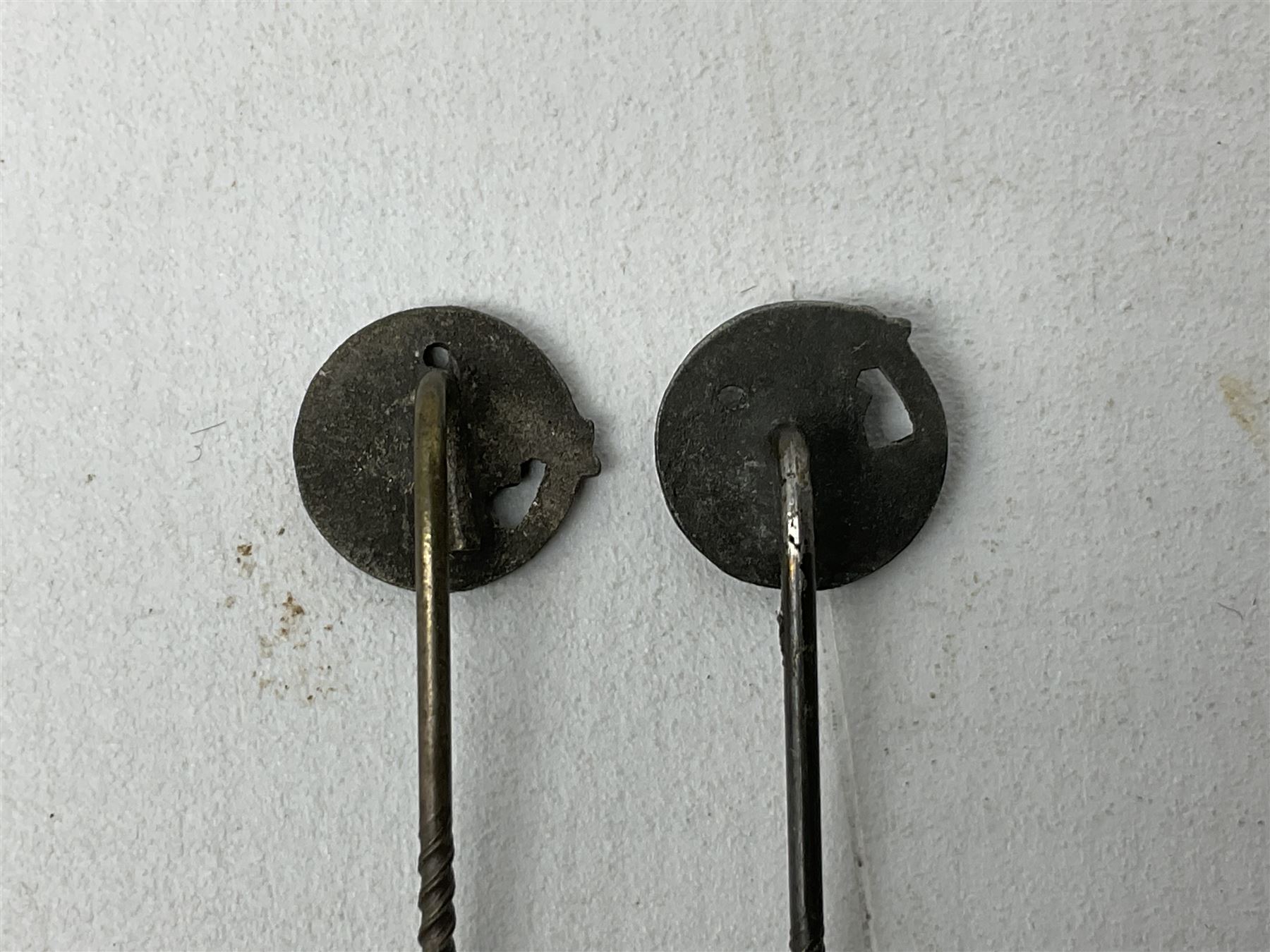 Nine WW2 German lapel pins including five Infantry Assault, Tank Assault etc 