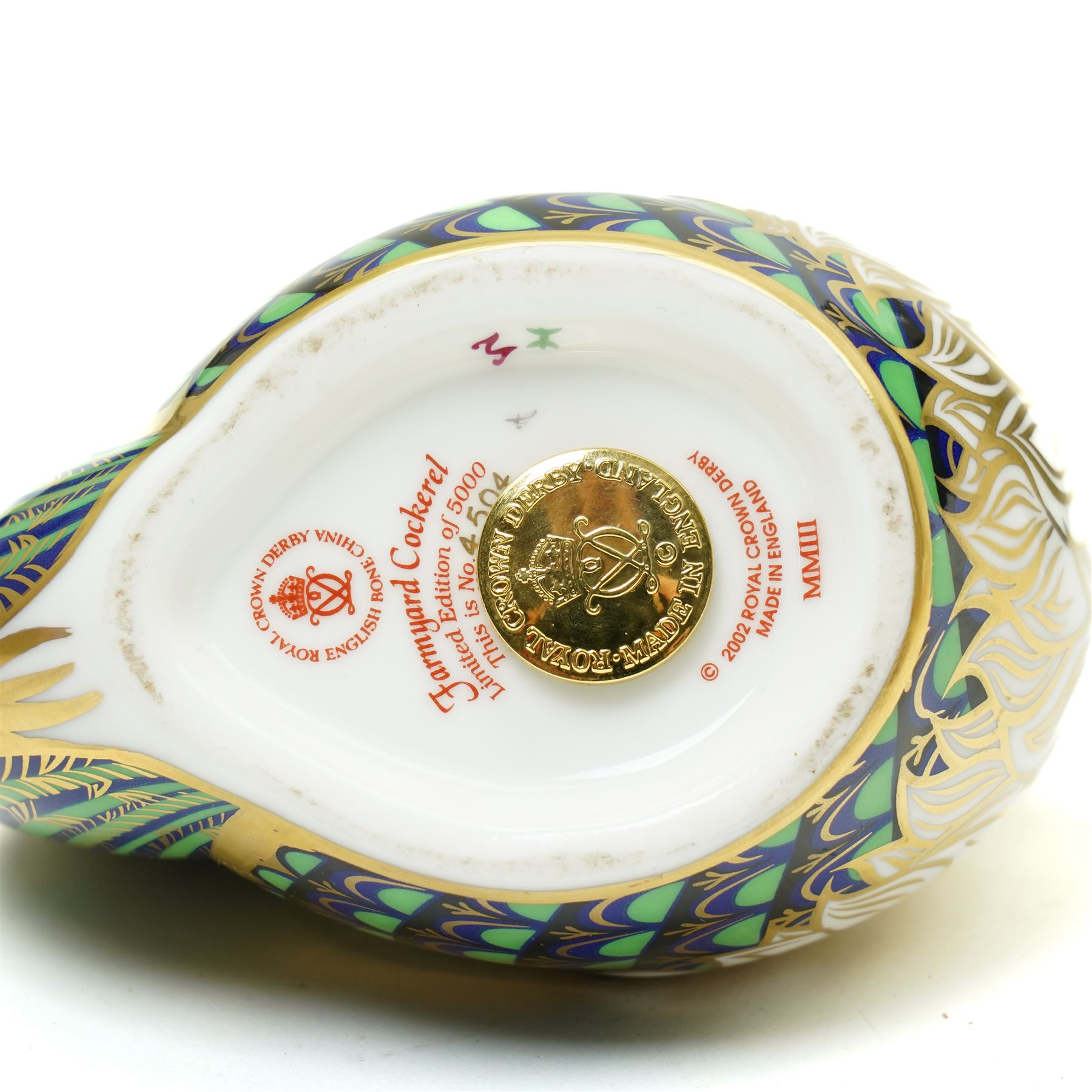 Four Royal Crown derby paperweight comprising Farmyard Cockerel 4504/5000, Farmyard Hen 4115/5000, both boxed and with certificates, Golden Carp and Jenny Wren, all with gold stoppers (4)
