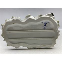 Two Capodimonte figures, comprising The Watchmaker by Curiase and Tramp Seated on a Bench, created by D.Bonalberti, tallest example H24cm