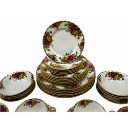 Royal Albert Old Country Roses pattern tea and dinner wares, comprising six dinner plates, six dessert plates, six bowls, six saucers, and four teacups. 