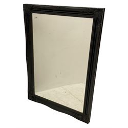 Bevelled mirror in black finish swept frame 