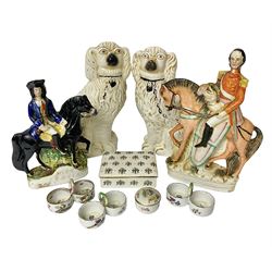 Staffordshire figure of the Duke of Wellington on a bay horse, H30cm in red uniform, together with a similar Staffordshire figure of Dick Turpin, pair of Staffordshire style dogs, H27cm, three Meissen style double salts and two trinket boxes 