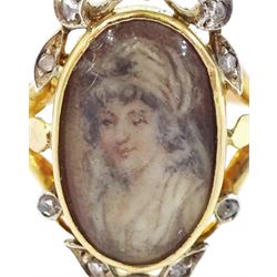 19th century gold and silver diamond portrait ring, set with an oval miniature of a woman on ivory, under a glazed panel, with rose cut diamond bow and floral sprigs below, to trifuricated shoulders. This lot has been registered for sale under Section 10 of the APHA Ivory Act
