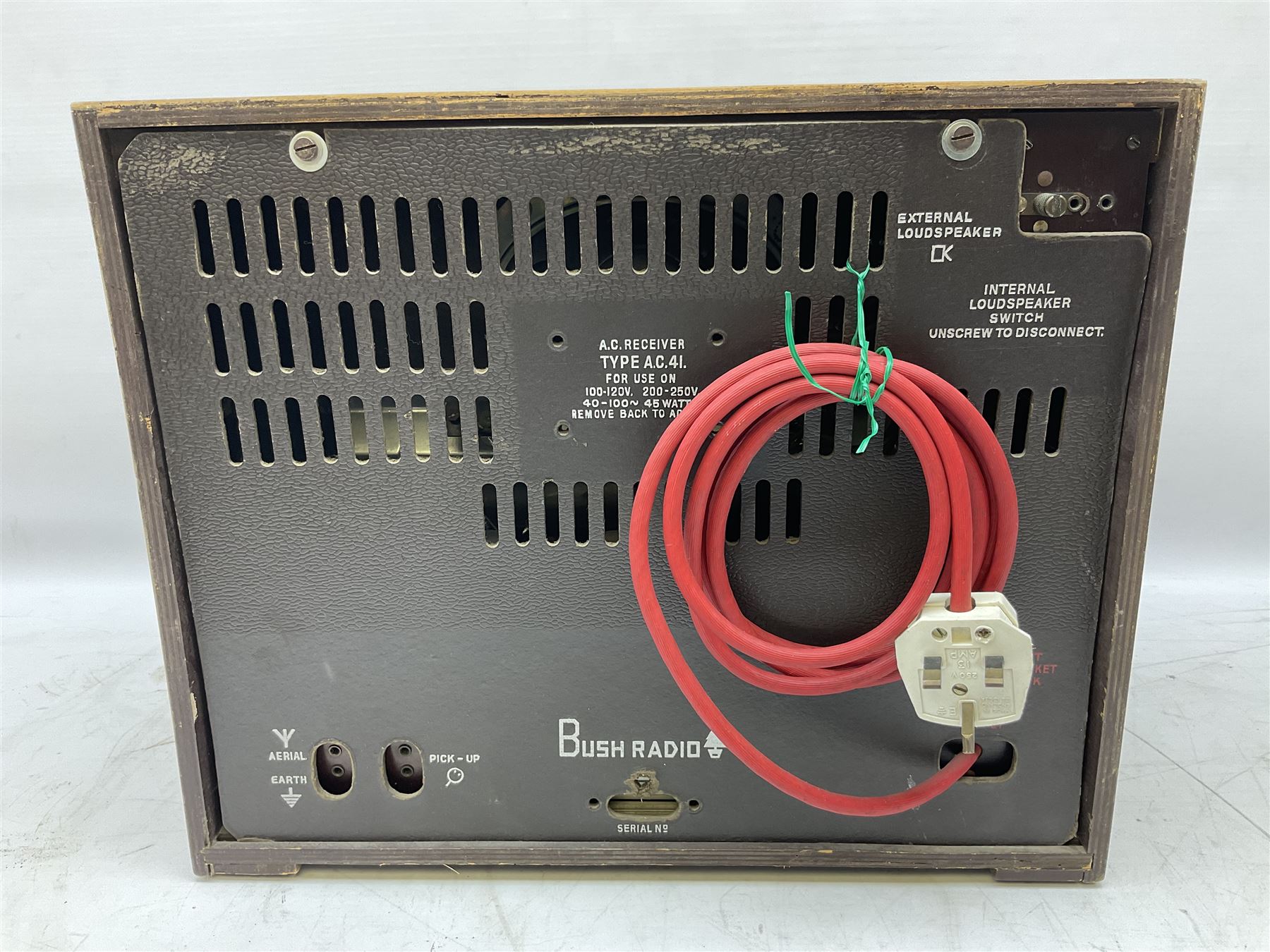 1950s Bush AC41 mahogany cased valve radio, 1930s Philips 588A with walnut veneer case, and 1940s Cossor Model 77, tallest H47cm W36cm D24cm