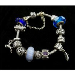 Collection of silver Pandora jewellery comprising a bracelet with thirteen Pandora charms and safety chain, necklace with one Pandora charm, and one stone set ring, in Pandora box